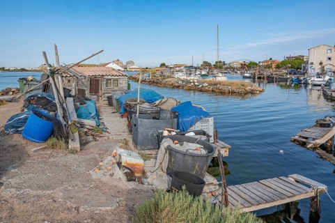 The traditional fishing port of La Pointe Courte with a small wooden shed, fishing nets, baskets
