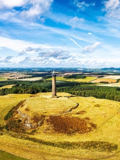 Waterloo Monument over Scottish fields and farms from a drone, Jedburgh, Scotland, UK
