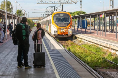 Renfe Civia commuter train at platform of Airport railway station, Rodalia de Barcelona suburban