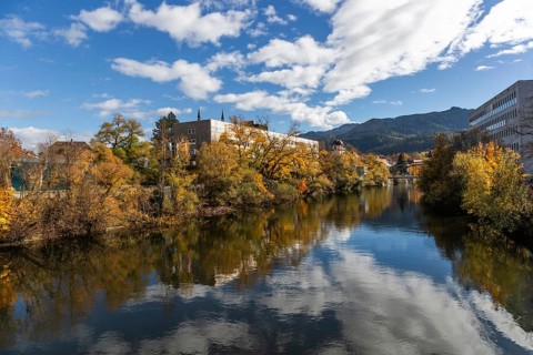 New town hall of the city of Leoben on the river Mur, autumn foliage, Leoben, Styria, Austria