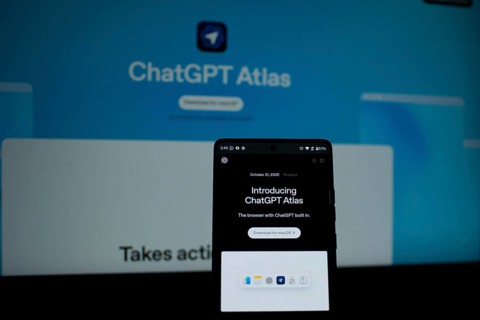 A smartphone showing ChatGPT Atlas with a bright blue background
