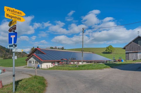 Blue sky with clouds, solar panels on barn roof near Kempten, Swabia, Bavaria, Germany