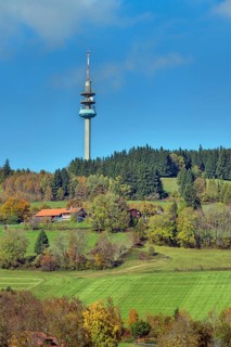 Blue sky with clouds, mixed forest, meadows and farm, Berg Blender with telecommunications tower