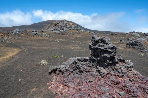 The barren volcanic desert of the Plaine des Sables along the Route du Volcan is dominated by