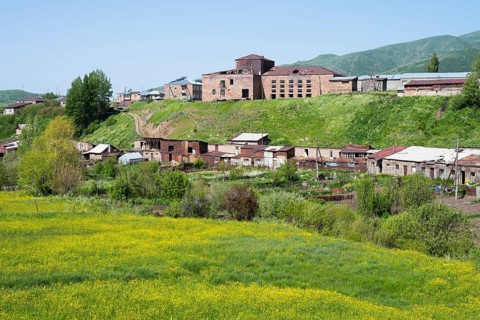 Rural village on green hills with scattered buildings and fields, Kechut, Kushchi, Kush-Bilyak,