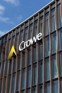 Crowe BPG, audit and consulting firm, logo on modern wooden façade with larch pilasters,