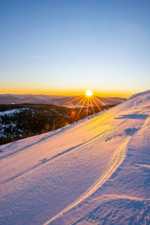 Sunrise over the hills of czech republic from Mount Lusen wth the view over the hills of the