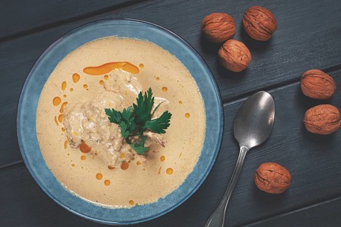 Satsivi, Georgian dish, chicken in nut sauce, cold appetizer, on a wooden table, no people,