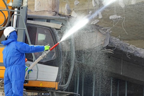 Demolition work in building construction. water jet against dust and dirt. Paderborn, North