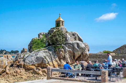 The small stone chapel of Saint-Gildas is perched on a distinctive rock of pink granite, while in