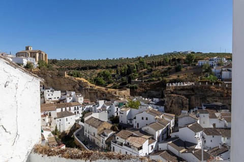 On the road to the white villages. Panorama or skyline of a historic old town with many white
