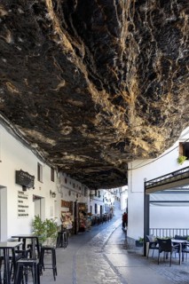 On the road to the white villages. Paths and narrow streets of a historic old town with many white