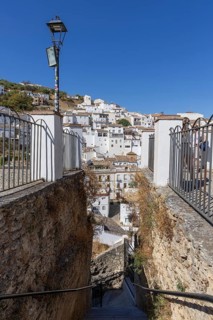 On the road to the white villages. Panorama or skyline of a historic old town with many white