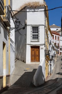 On the road to the white villages. Paths and narrow streets of a historic old town with many white