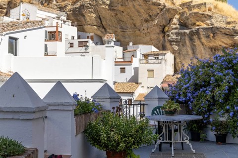 On the road to the white villages. Paths and narrow streets of a historic old town with many white