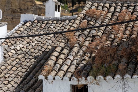 On the road to the white villages. Beautiful roofs of the historic old town in Setenil de las