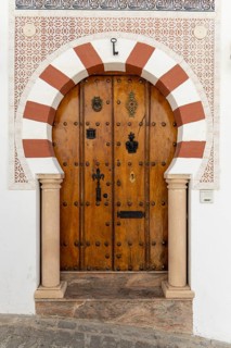 On the road to the white villages. Beautiful doors of the historic old town in Setenil de las