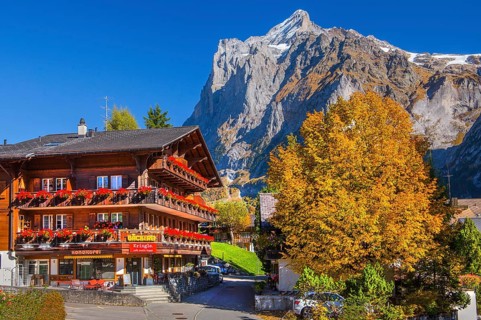 Village bakery with Wetterhorn 3690m in autumn, Grindelwald, Lütschinental, Bernese Oberland,