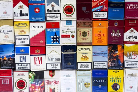 PRAGUE, CZECH REPUBLIC - MARCH 25: Many packs of different cigarettes photographed with top view