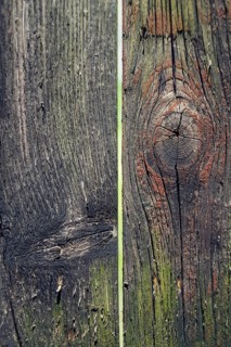 Colorful filtered old knotty wood texture background with hole Prague, Czech republic