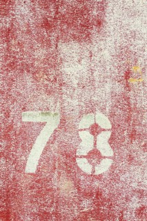 Number 78 on vintage rusty red and white metal sheet plate Prague, Czech republic