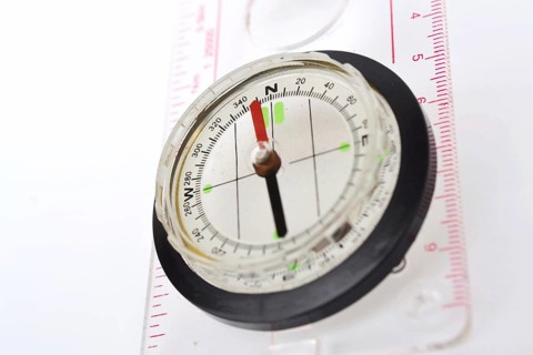 Detail shot of glass compass isolated on white background Prague Czech republic