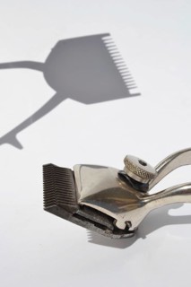 Old vintage hair clippers isolated on white background Prague Czech republic