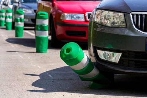 Car bending white and green safety traffic post with front bumper, wrong parking, car insurance,