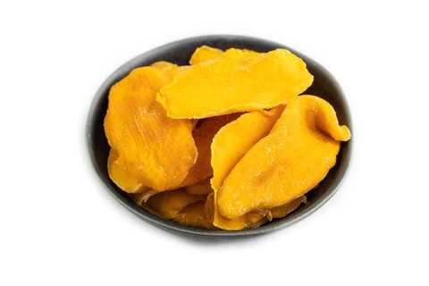 Dried Mango in blue ceramic bowl isolated on white background. Side view, close up, flat lay.