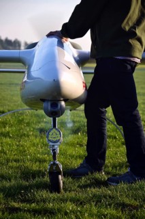 Man preparing unmanned aerial vehicle drone with light and camera Pisek Czech republic