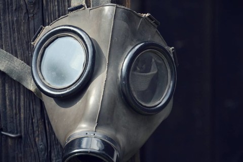 Closeup of a gas mask on a wooden background