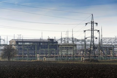 Distribution power station with electricity pylons and dramatic cloudy sky background Prague Czech