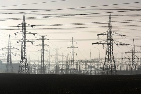 Electricity pylons leading from distribution power station Prague Czech republic