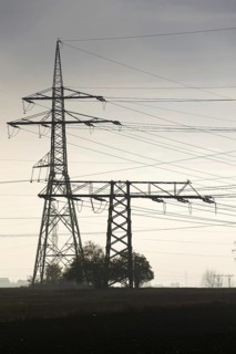 Electricity pylons leading from distribution power station Prague Czech republic