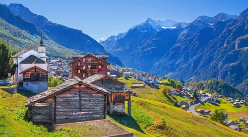 City overview on a mountain terrace above the valley with Ulrichshorn 3925m, Grächen, Mattertal,