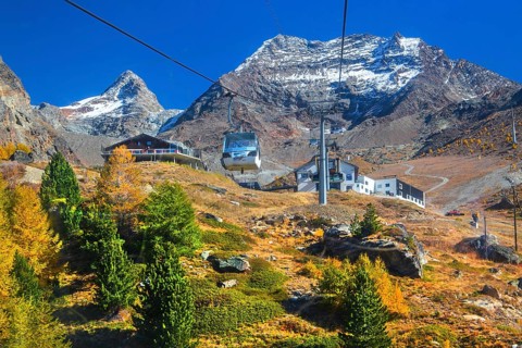 Hohsaas cable car in front of Kreuzboden mountain station with Fletschhorn 3986m in autumn,