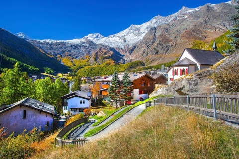 City overview with Allalin 4027 m, Alphubel 420 6 m and Mischabel group 4545 m in autumn, Saas-Fee,
