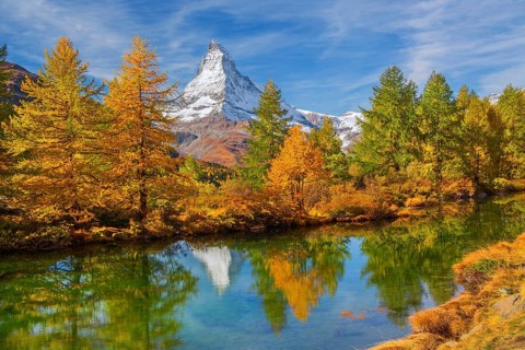 Matterhorn 4478 m with reflection in Lake Grindji in autumn, Zermatt, Mattertal, Valais,