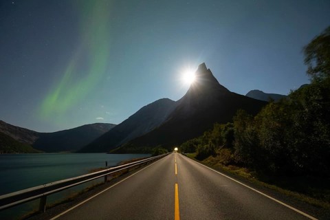 National mountain of Norway - Stetind in the Nordland under auroras and a full moon
