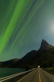 Magical Stetind, mountain in northern Norway under auroras and full moon