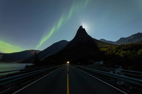 National mountain of Norway, Stetind in the Nordland under auroras and a full moon behind the