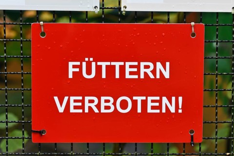German Do not feed sign at zoo or animal enclosure, warning for visitors and wildlife protection
