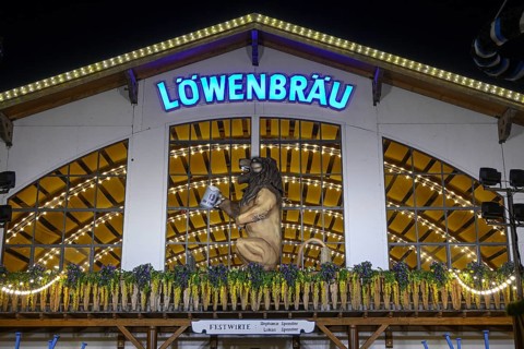 Löwenbräu festival tent at Oktoberfest, night view, Munich, Bavaria, Germany