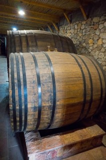 Two large wooden barrels in a cellar with rustic stone walls, Hin Areni Winery, Areni Village,