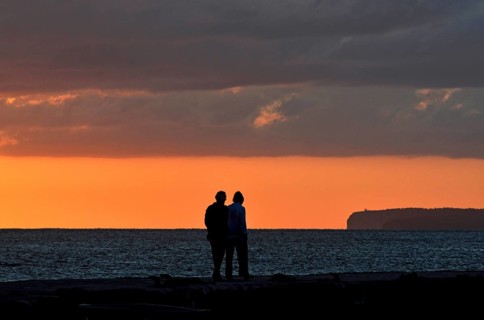 Silhoutte of an elderly couple at sunset time, Majorca, balearics, spain