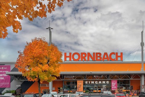 Autumn-colored maples (Acer), and entrance to Baumarkt-hornbach, Kempten, Swabia, Bavaria, Germany