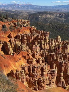 Impressive red rock landscape with sweeping views over layered, smoky rocks, Bryce Canyon National