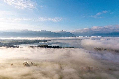Cloudy landscape with Forggensee and mountain panorama at dawn, near Roßhaupten, Ostallgäu, Allgäu,