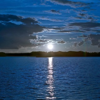 Atmospheric moonrise over Lake Gudelack, Lindow (Mark), Stechlin-Ruppiner Land nature park Park,