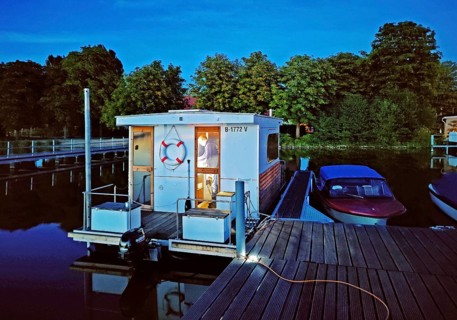 Houseboat at dusk at Marina Lindow (Mark), Gudelacksee, Stechlin-Ruppiner Land nature park Park,